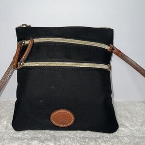 Vintage DOONEY & BOURKE black nylon and leather trim triple zip crossbody bag.